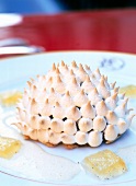 Close-up of apple tart with meringue and quince jelly on plate