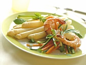 Asparagus with basil shrimp on plate