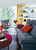 Modern living room with wool fabric sofa, felt pad and shelves