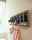 Weekly Planner with seven boards, with shelf and hooks on wall