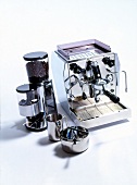 Latest technology chrome espresso machine and grinder on white background