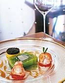 Terrine of leeks and langoustine on glass plate