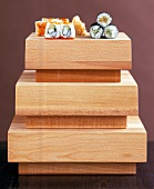 Solid blocks of wood used for serving and preparing sushi