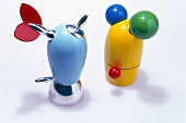 Colourful salt and pepper mills on white background