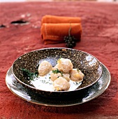 Close-up of pumpkin and sage with dry herbs sprinkled served in a bowl