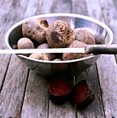 Beetroot in steel bowl with placed knife over it