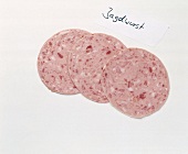 Sliced of Jagdwurst sausage on white background