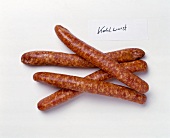 Cabbage sausages on white background