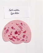 Slice of Spiker ham on white background