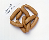 Close-up of sausages on white background