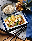 Cooked snapper with pineapple on square plate