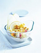 Bowl with quinoa, muesli and pear slices