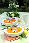 Carrot coconut soup with croutons in bowl