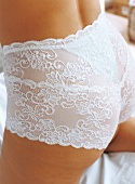 Close-up of woman wearing white lace French knickers