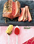 Slices of piglet venison with herbs and dip