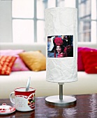Lamp with geisha photo on paper screen on table