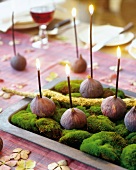 Figs with lighted candle in tray - Thanksgiving decoration