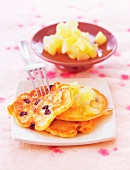 Close-up of pancakes with apple and pears on plate