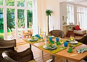 Dining table laid with artichokes, dishes and wines