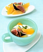 Oranges, figs, cottage cheese, honey and pistachios in a free cup