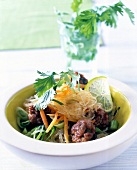 Thai meatballs with Asian glass noodle salad in bowl