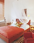 Bedroom with red leather sofas and ceilings