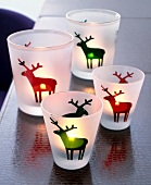 Frosted lanterns glasses with red and green moose