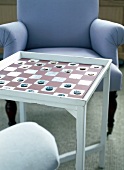 Table with chessboard in brown and silver