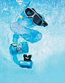 Blue and black coloured diving and swimming equipments underwater
