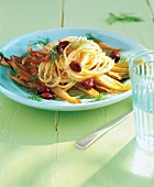 Spaghetti with fennel and black olives on plate