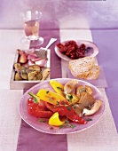 Three plates of starters garnished with thyme