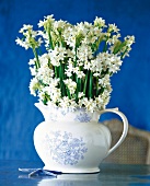 Close-up of bouquet of daffodils in china jug