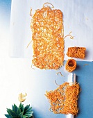 Fried sweet potato strips on paper