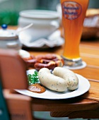 Bavarian veal sausage with sweet mustard on plate