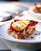 Close-up of goat cheese and radicchio tart on plate