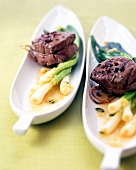 Pickled spring onions with fillet steak and Sichuan pepper on leaf shaped plate