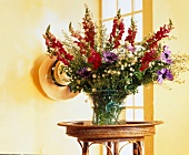Colourful summer bouquet in glass vase