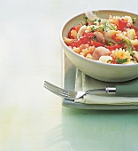 Fusilli pasta with fennel and tomatoes in bowl