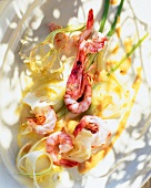 Shrimps with fennel, garlic and saffron sauce on plate