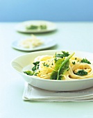 Spinach lemon spaghetti on white plate