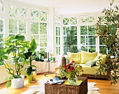 Conservatory with cane furniture and houseplants