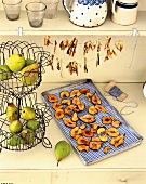 Dried pears on tray and dried mushroom on leash