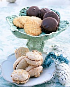 Close-up of Christmas cookies and chocolate macaroons in serving dish