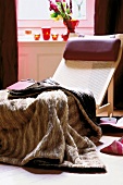 Faux fur blanket on cozy window seat in living room