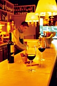 Glass of wine on bar counter of Vins i Platillos, Barcelona, Spain
