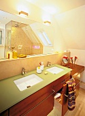 Frosted mirrors and bathroom vanity made of cherry wood in bathroom