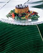 Veal tandoori with wok vegetables in peanut foam on plate