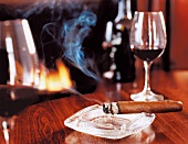 Burning cigar in ash tray