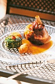 Close-up of lamb shank on plate