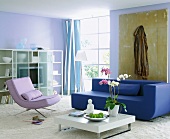 Bright living room decorated in blue, white and lilac colours
